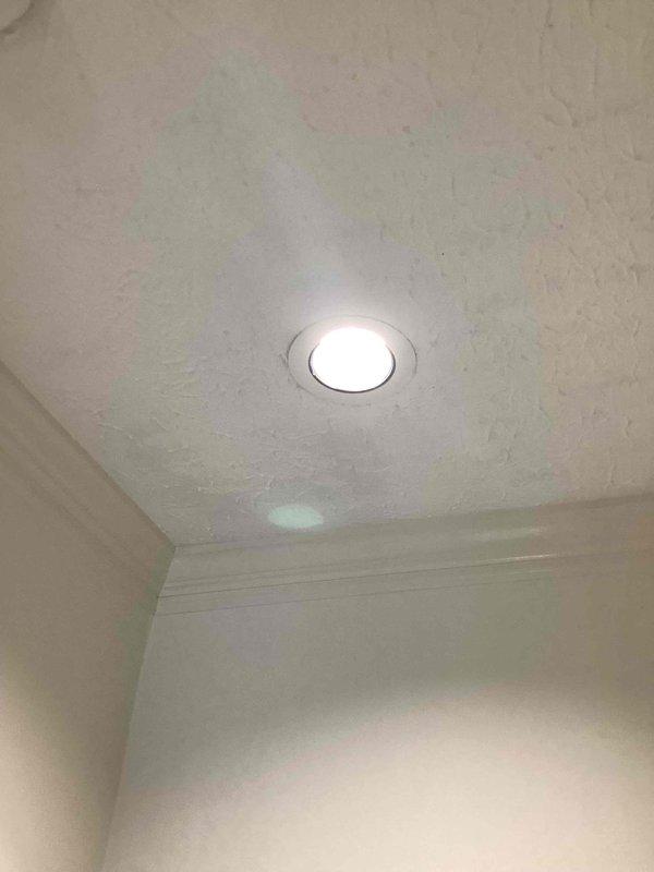 Installed two premium six-inch recessed light trims in the downstairs hallway ceiling. Both fixtures were properly secured with trim rings and tested for proper illumination upon completion.