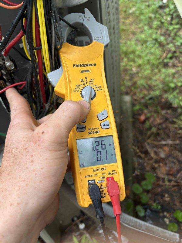 Completed comprehensive spring preventive maintenance on 2018 HVAC system including 80-point inspection, outdoor coil cleaning, burner cleaning, and gas pressure adjustments. Discovered failed relay component with significant heat damage and charring in control panel during safety inspection. Measured electrical readings at 12.6 amps and 0.1 volts using clamp meter to verify system performance and diagnose control circuit failure.
