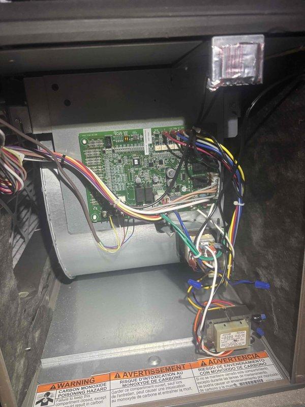 Responded to service call for high indoor humidity levels on 1.5-year-old HVAC system. Performed diagnostic inspection of system controls and circuit board connections. Accessed control panel, verified proper wiring configuration and examined electronic components including thermostat connections and control board functionality to identify potential causes of humidity control issues.