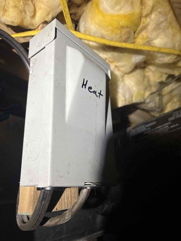 Responded to service call for HVAC system not cooling and running continuously. Upon arrival, accessed attic-mounted air handler and inspected electrical control box, wiring connections, and internal components. Unit was found in off position at thermostat at time of inspection. Documented equipment condition with photos of control box interior showing wiring configuration and heat strip components for further evaluation and potential recall verification.