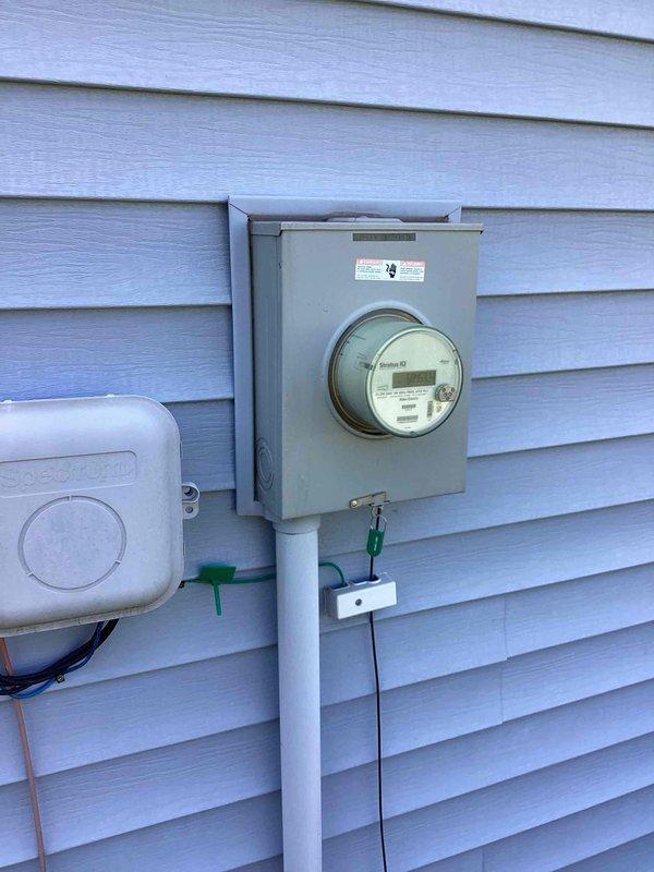 Responded to service call for EV charger repeatedly tripping circuit breaker after approximately 15 minutes of operation, displaying solid red light and audible alarm. Inspected electrical panel, EV charger installation, and associated grounded outlet on same circuit which tested with yellow ground fault indicator. Documented existing electrical meter installation and exterior conduit routing. Advised homeowner that charger was not installed by our company and recommended contacting original installer to diagnose potential ground fault issue, undersized circuit, or defective charger unit causing repeated trips.