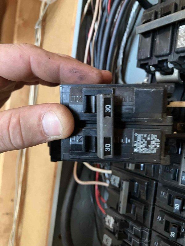 Responded to no-power emergency at 1980s residential property. Upon inspection, discovered severe thermal damage to main breaker assembly in outdoor electrical service panel, with visible burn marks and melted components on the main disconnect. Panel exhibited catastrophic failure requiring complete replacement. Evaluated existing 30-amp double-pole breaker and overall panel configuration. Documented extensive charring on main breaker housing and compromised panel integrity. Provided second opinion confirming complete outdoor service panel replacement necessary to restore safe electrical service to property.
