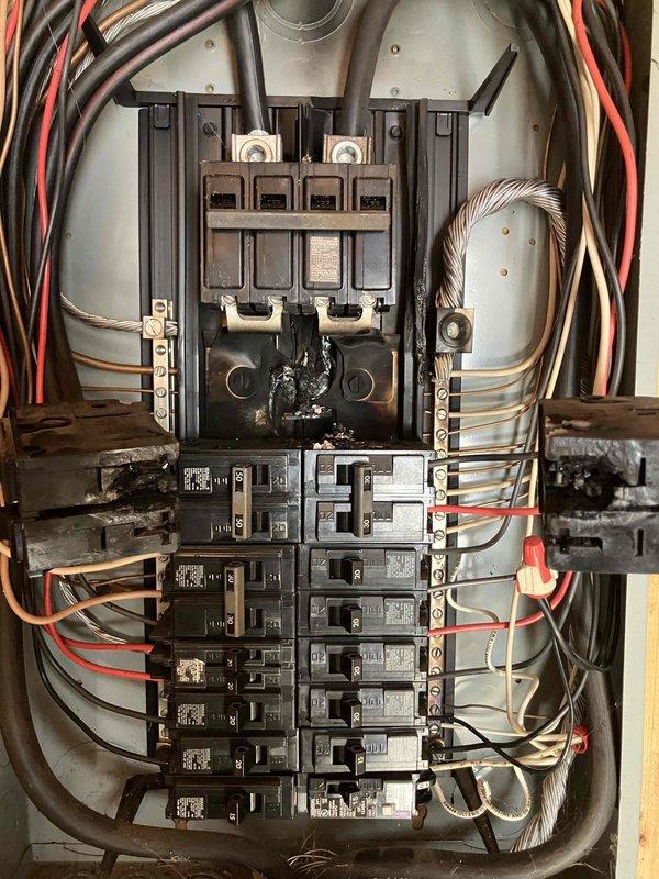 Responded to no-power emergency at 1980s residential property. Upon inspection, discovered severe thermal damage to main breaker assembly in outdoor electrical service panel, with visible burn marks and melted components on the main disconnect. Panel exhibited catastrophic failure requiring complete replacement. Evaluated existing 30-amp double-pole breaker and overall panel configuration. Documented extensive charring on main breaker housing and compromised panel integrity. Provided second opinion confirming complete outdoor service panel replacement necessary to restore safe electrical service to property.