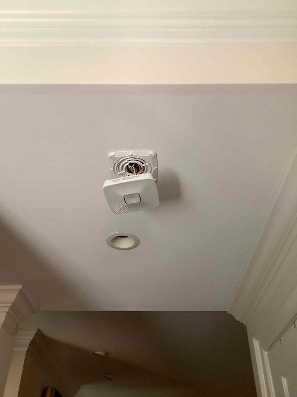 Responded to service call for multiple hardwired smoke and carbon monoxide combination detectors intermittently alarming for approximately 30 seconds before stopping, with issue occurring over the past week. Upon arrival, inspected all hardwired combination smoke/CO detectors throughout the residence built in 2003. Homeowner had previously replaced backup batteries in units one week prior, but nuisance alarms continued. Evaluated detector mounting, wiring connections, and unit functionality. Detectors showed signs of age-related sensor degradation common in units approaching or exceeding their 10-year service life. Recommended replacement of all combination detectors to resolve intermittent false alarm condition and ensure reliable life safety protection, as detector sensors deteriorate over time and cannot be repaired or cleaned effectively.