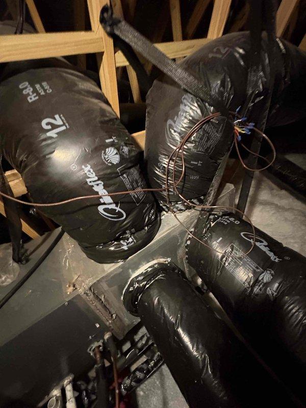 Relocated supply duct from distribution box to main furnace plenum to improve airflow to bedroom. Patched and sealed penetration in distribution box with appropriate materials, then installed manual dampers on three main supply trunk lines to enable zone balancing and temperature control throughout the system.