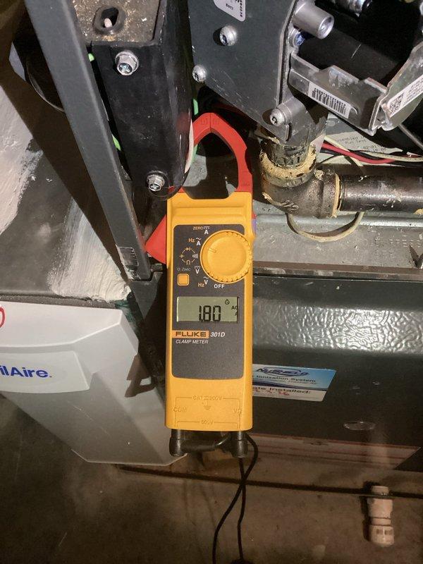 Completed comprehensive heating and air maintenance on 2018 unit including full 80-point inspection, outdoor coil cleaning, burner cleaning, gas pressure adjustment, and safety inspections. Verified system pressures using calibrated digital manometer and confirmed electrical amperage readings with clamp meter showing 188A operation. All equipment operating within manufacturer specifications.