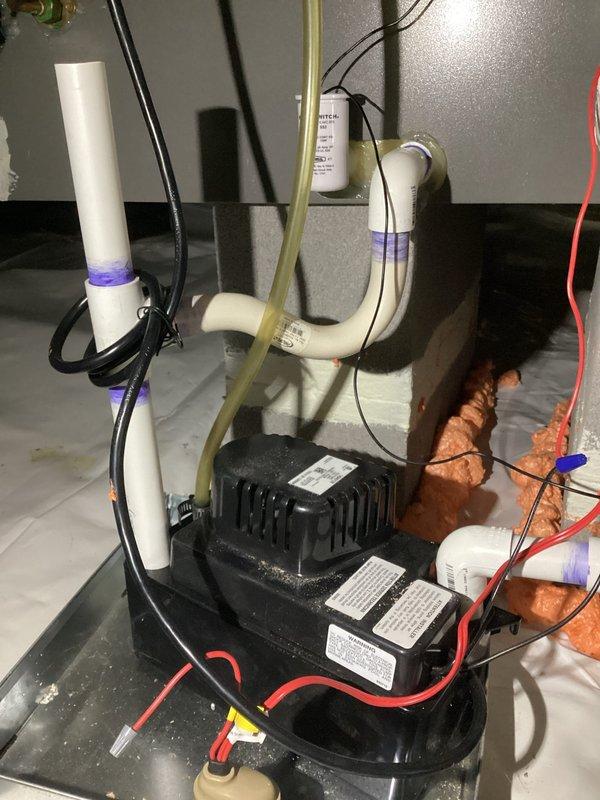 Completed comprehensive spring preventive maintenance on three HVAC systems covering 2017 installation, performing 80-point inspections on each unit including outdoor coil cleaning, burner cleaning, gas pressure adjustments, and safety checks. Inspected and documented third-floor air handler unit (Model FEM4X2400CL, Serial F223444034, manufactured August 2022) with 410A refrigerant system rated at 208/230V. Verified proper operation of condensate pump assembly with associated PVC drainage lines and electrical connections, ensuring all safety controls and drainage systems functioning correctly across all units.