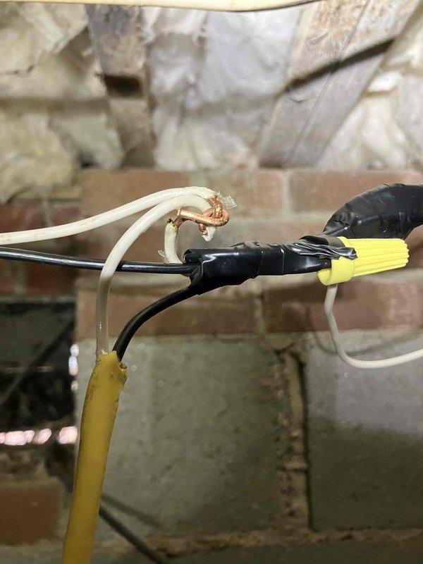 Completed annual 32-point electrical system evaluation and preventative maintenance service. Performed comprehensive electrical panel maintenance including torque verification and connection inspection of all breakers and bus bars. Conducted testing of all GFCI and shock protection outlets and breakers to verify proper ground fault protection functionality. Tested arc fault circuit interrupter breakers to ensure fire protection systems operating within specifications. Performed smoke and carbon monoxide detector maintenance including battery replacement and operational testing throughout residence. Replaced customer-supplied light bulbs in fixtures up to 12 feet and cleaned ceiling fans up to 12 feet. During attic inspection, identified electrical junction connections with exposed copper conductors showing oxidation and improper wire nut connections in insulated space. Documented substandard wiring junctions requiring attention for safety and code compliance. All accessible electrical 