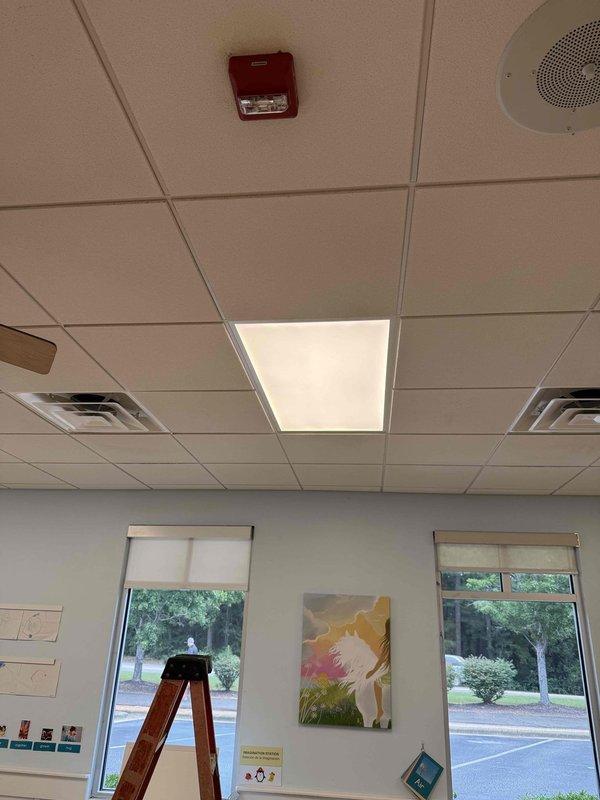Responded to lighting outage in two rooms of commercial facility. Troubleshot and replaced non-functioning fluorescent light fixtures in the Ducklings room and Robin's room, working at 8-foot ceiling height using ladder. Verified all lighting circuits operational and restored full illumination to both areas upon completion.