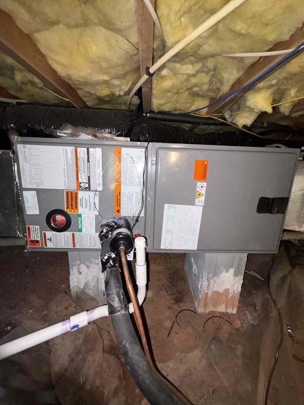 Completed full system replacement installing a Rheem 2-ton heat pump system consisting of RP14AY24AJ2NA outdoor condenser unit (14.3 SEER2, 7.5 HSPF2, R-454B refrigerant, 2-stage operation) and RH2TY2417STANNJ indoor air handler with constant torque motor and N-coil configuration. Removed existing HVAC equipment from premises and installed new outdoor condenser pad to support replacement unit. Installed Tutco 5kW heat kit (model HKR-05, 240V) within air handler assembly to provide supplemental heating capacity. Configured and mounted customer-provided Honeywell TH2320WF4010/U FocusPro Smart Thermostat with 3 heat/2 cool staging capability for system control. Installed float switches for condensate overflow protection on air handler unit. Completed all refrigerant line connections, electrical wiring, and ductwork connections to air handler positioned in crawlspace installation. Performed complete system startup procedures including refrigerant charge verification, airflow measurements, 