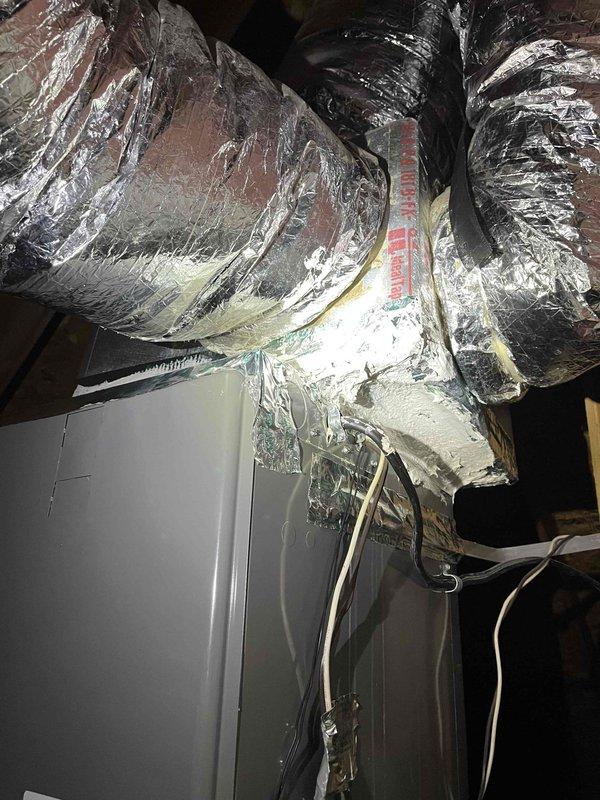 Responded to possible recall for recently installed central air system with no cooling and inconsistent operation. Investigated upstairs bonus room thermostat reading inaccurately despite previous replacement of both thermostat and control board. Inspected air handler wiring connections, control board operation, and attic ductwork installation to diagnose intermittent cooling failure on less than 5-year-old equipment.