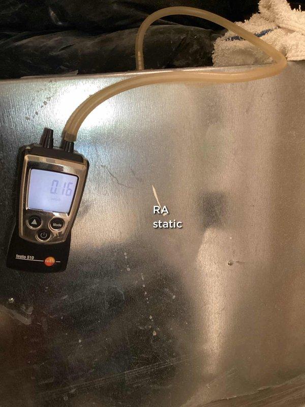 Responded to service call for reported condensation pump line issue on 15-year-old system. Performed diagnostic evaluation of HVAC unit including static pressure measurements at return air, recording 0.18" reading with Testo 510 differential pressure meter. Inspected White Rodgers control board (model 2580-931) and verified proper wiring connections and system controls for heating and cooling operations.