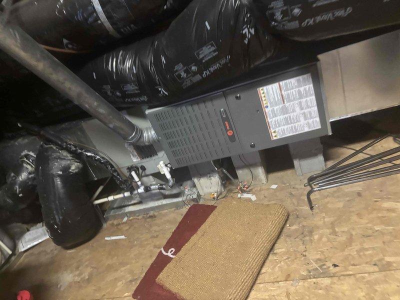 Completed comprehensive tune-up on 2013 HVAC system including inspection of furnace control board, gas valve assembly, burner components, and all electrical connections. Thoroughly inspected crawlspace ductwork and air handler unit per customer request regarding potential mold concerns; confirmed all ductwork and equipment surfaces are clean with no visible mold growth or biological contamination present. System tested and operating within normal parameters.