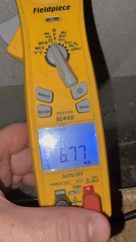 Responded to rental property for possible recall inspection on system installed in 2022. Upon arrival, confirmed unit was not operating. Performed complete heating and air check including 80-point inspection, outdoor coil cleaning, burner cleaning, gas pressure adjustments, and comprehensive safety inspections. Diagnostic testing with multimeter confirmed electrical readings, and verified equipment specifications on unit nameplate (Model RHEMV3621MECU1, Serial V2C2958202).
