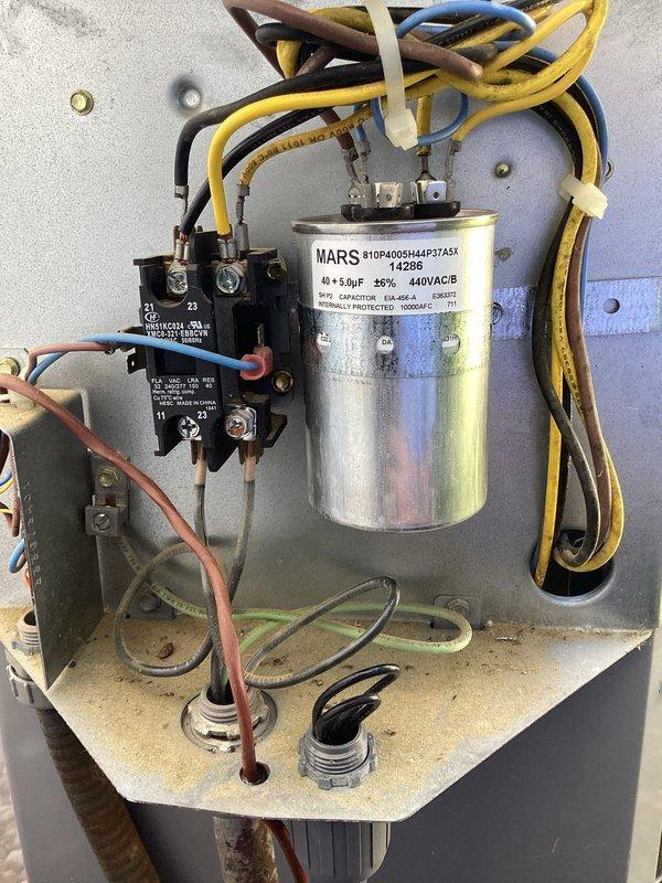 Responded to no cooling call where circuit breaker was repeatedly tripping when reset. Upon inspection, diagnosed failed run capacitor causing electrical short and immediate breaker trip. Replaced defective capacitor with new MARS 40+5 MFD 440VAC dual run capacitor, verified all electrical connections, and tested system operation. Unit now cooling properly with stable amperage draw and no breaker issues.