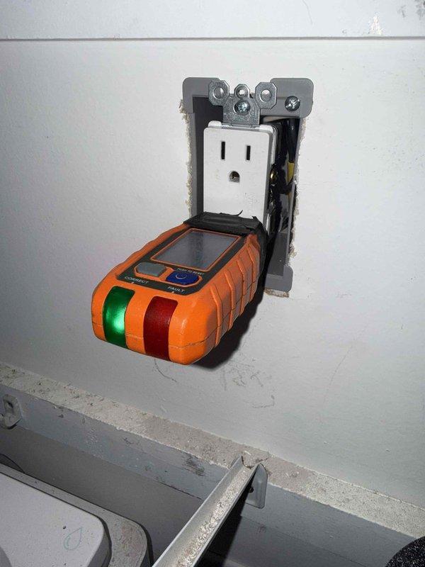 Responded to kitchen microwave outlet with no power in 1985 home with updated electrical service. Upon arrival, homeowner reported that a loose wire connection on the back of the outlet had been temporarily addressed, restoring power to the microwave. Performed voltage testing on the affected outlet using electronic circuit analyzer to verify proper operation and grounding. Confirmed outlet is on shared circuit with refrigerator and dining room receptacles. Conducted systematic inspection of accessible outlets and receptacles throughout kitchen and dining room areas to identify any additional loose connections, improper wiring methods, or code violations that may have been installed by previous owner. Documented electrical panel configuration and verified proper circuit protection for kitchen appliances.