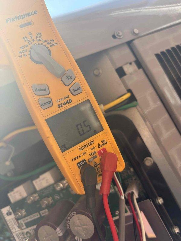 Responded to no cooling complaint on downstairs unit. Upon arrival, system was off and not operating. Performed diagnostic testing on control board and electrical components using multimeter, measuring voltage and capacitance readings. Found control board displaying 85V and 0.5 reading during testing, indicating potential electrical or control circuit issue preventing system operation. Identified failed component preventing unit from powering on and cooling properly.