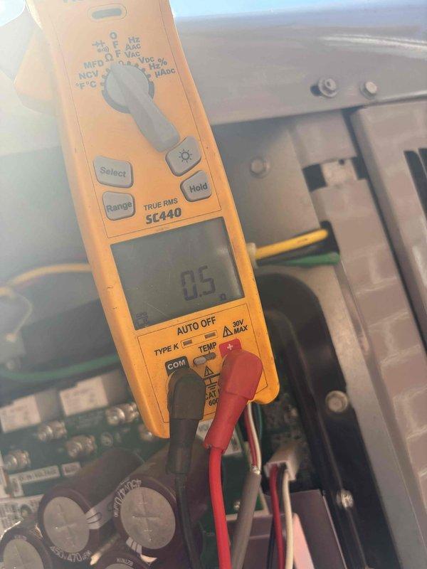 Responded to no cooling complaint on downstairs unit. Upon arrival, system was off and not operating. Performed diagnostic testing on control board and electrical components using multimeter, measuring voltage and capacitance readings. Found control board displaying 85V and 0.5 reading during testing, indicating potential electrical or control circuit issue preventing system operation. Identified failed component preventing unit from powering on and cooling properly.