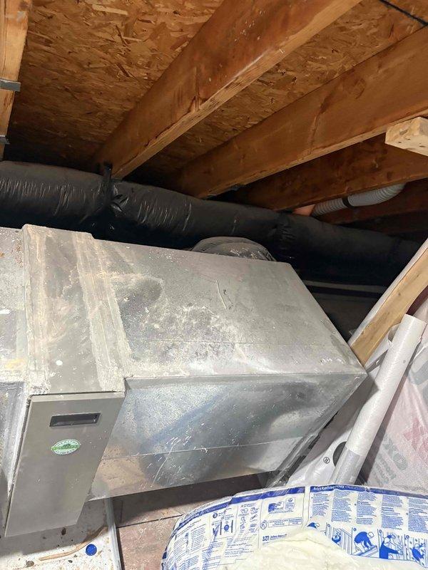Responded to no cooling complaint on 2014 HVAC system with insufficient airflow at thermostat. Inspected air handler unit located in attic space and found system operational but delivering weak airflow to living space. Performed diagnostic evaluation of ductwork, refrigerant lines, and air handler components to determine root cause of inadequate cooling performance.