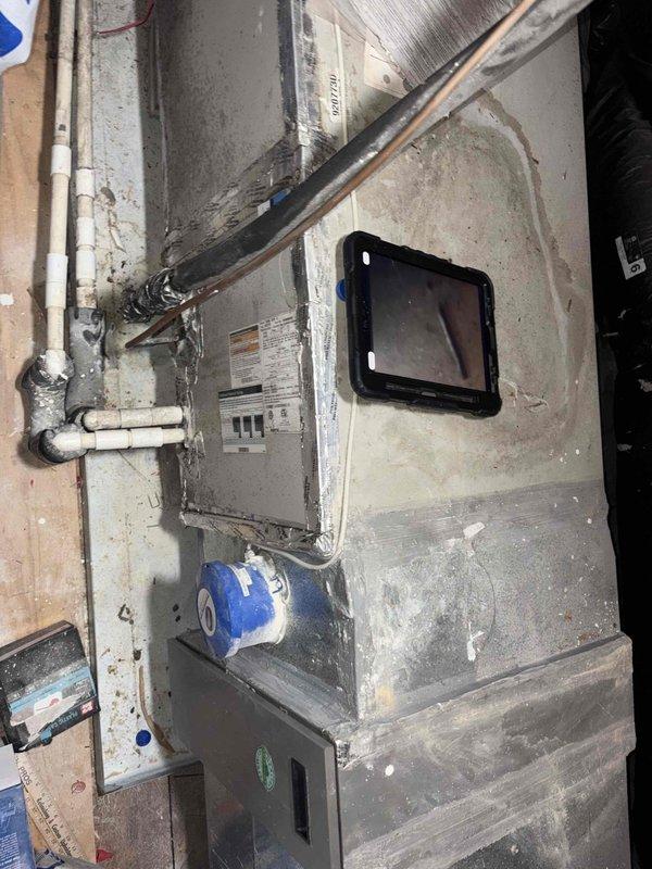 Responded to no cooling complaint on 2014 HVAC system with insufficient airflow at thermostat. Inspected air handler unit located in attic space and found system operational but delivering weak airflow to living space. Performed diagnostic evaluation of ductwork, refrigerant lines, and air handler components to determine root cause of inadequate cooling performance.