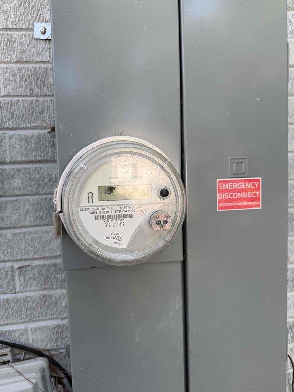 Installed motion sensor LED light fixture on pergola structure at rear of residence, replacing existing non-sensor light. Assessed electrical panel connections and verified proper circuit capacity at main service meter location to ensure adequate power supply for new three-head LED fixture with integrated motion detection capability.