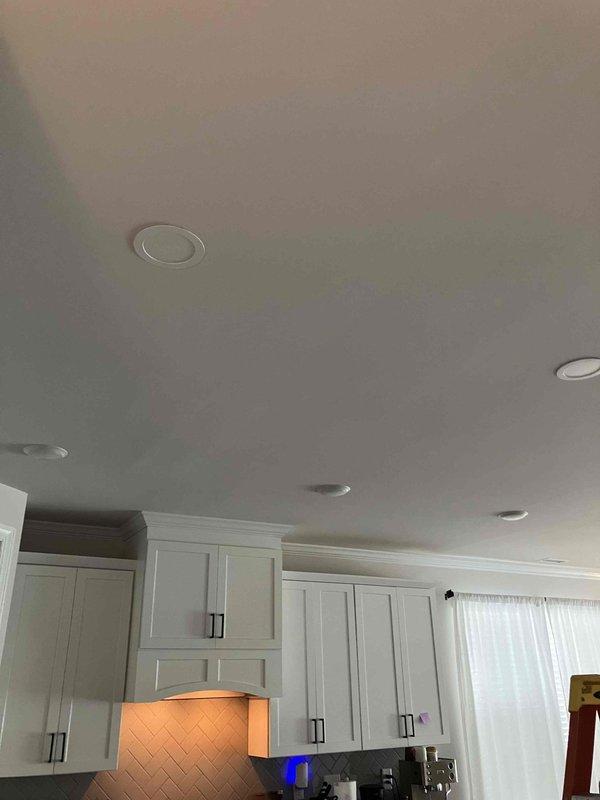 Completed comprehensive electrical upgrade including installation of new LED wafer recessed lighting fixtures throughout the interior of the residence, with multiple units installed in the kitchen area as evidenced by the flush-mounted circular fixtures with white trim rings. Installed whole home surge protection device at the main electrical panel to safeguard all household circuits and electronics from voltage spikes and power surges. Additionally, installed dedicated equipment surge protector for the air conditioning unit to protect HVAC system from electrical damage. All installations performed to current NEC standards with proper circuit connections and grounding, and all work covered under warranty.