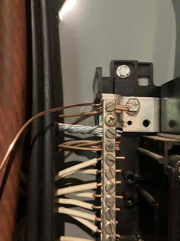 Performed load calculation and site assessment for electrical service installation to detached shed at 1987 residential property. Inspected existing main electrical panel to determine available capacity for new circuit addition. Evaluated current breaker configuration and wire routing to establish feasibility of extending power to outbuilding. Documented panel conditions and existing electrical infrastructure with photos for quote preparation.