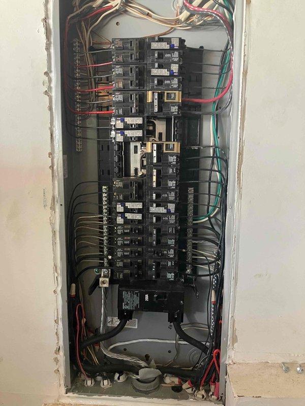 Completed comprehensive 32-point electrical system evaluation including inspection and maintenance of interior electrical panel and exterior junction box with HVAC control modules. Performed torque verification and connection checks on all circuit breakers, tested GFCI outlets and breakers for proper shock protection functionality, and verified arc fault breakers for fire protection compliance. Conducted smoke and carbon monoxide detector maintenance with battery replacement and operational testing, replaced customer-supplied light bulbs in fixtures up to 12 feet, and cleaned ceiling fans up to 12 feet in height.