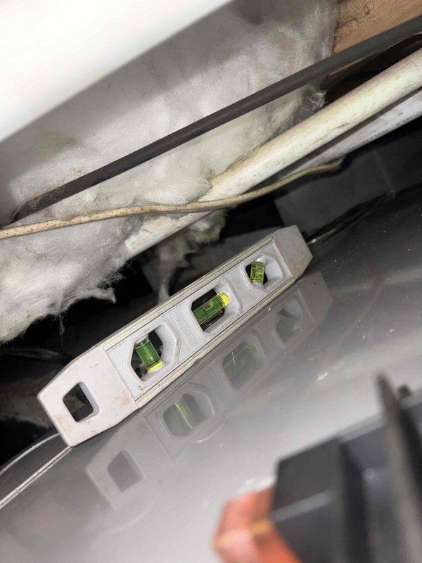 Completed full system replacement including removal of existing HVAC equipment and installation of new Rheem 2.5-ton two-stage heat pump system (RP14AY30AJ2NA, 14.3 SEER2, R-454B refrigerant) paired with Rheem 3-ton two-stage multipoise air handler (RH2TY3617STANNJ) with constant torque motor and N-coil configuration. Installed new outdoor condenser pad to provide stable, level foundation for heat pump unit. Integrated Tutco 5kW heat kit (HKR-05 series, 240V) into air handler for supplemental heating capacity. Installed Honeywell Home FocusPro Smart Thermostat (TH2320WF4010/U) with 3 heat/2 cool staging capability for precise temperature control and system optimization. Added float switches to air handler drain pan for overflow protection and water damage prevention. Installed AirScrubber air purification system with electronic controls, mounted directly to supply ductwork with appropriate wiring and power connections. Verified proper refrigerant charge, airflow, and system pressures t