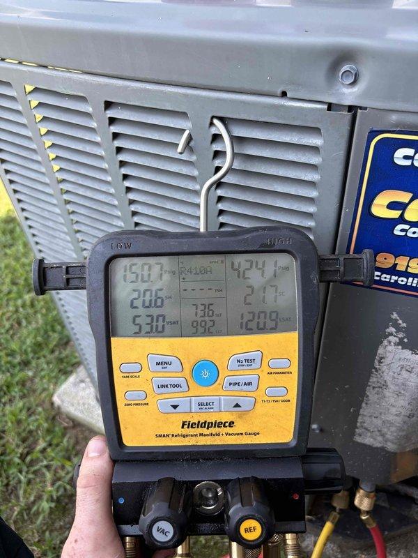 Responded to no cooling complaint on 11-year-old downstairs system that had been inoperative for over 10 days. Previous contractor had diagnosed blower motor failure but failed to follow through with repair. Upon arrival, performed comprehensive diagnostic testing using digital manifold gauges and multimeter to verify system operation and electrical components. Readings indicated 226V supply voltage and refrigerant pressures showing system parameters. Evaluated blower motor assembly and overall unit functionality to determine proper repair solution and provided timeline for parts procurement and installation to restore cooling operation.