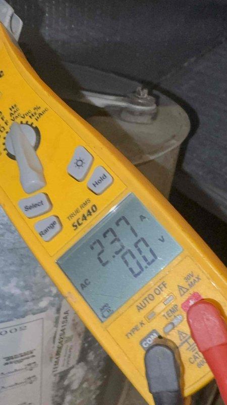 Responded to no cooling complaint on 11-year-old downstairs system that had been inoperative for over 10 days. Previous contractor had diagnosed blower motor failure but failed to follow through with repair. Upon arrival, performed comprehensive diagnostic testing using digital manifold gauges and multimeter to verify system operation and electrical components. Readings indicated 226V supply voltage and refrigerant pressures showing system parameters. Evaluated blower motor assembly and overall unit functionality to determine proper repair solution and provided timeline for parts procurement and installation to restore cooling operation.