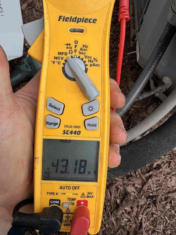 Responded to no cooling call on dual zone system installed in 2021. Upon arrival, confirmed complete loss of cooling to both zones. Inspected electrical panel and found A/C circuit breaker tripped. Reset breaker and verified system power restoration with multimeter reading 43.18 volts at condensing unit. System restored to normal operation with both zones cooling properly.
