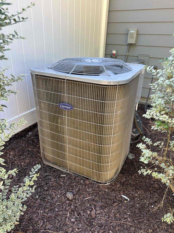 Completed annual HVAC preventive maintenance on 2021 Carrier outdoor condensing unit. Performed comprehensive inspection of condenser coil, fan motor, compressor, and electrical connections. Noted weathering and corrosion on internal electrical connection box and control panel components with visible mineral deposits and debris accumulation. Cleaned condenser coil, checked refrigerant pressures, verified proper fan operation, and tested all safety controls. Unit operating within manufacturer specifications upon completion of maintenance service.