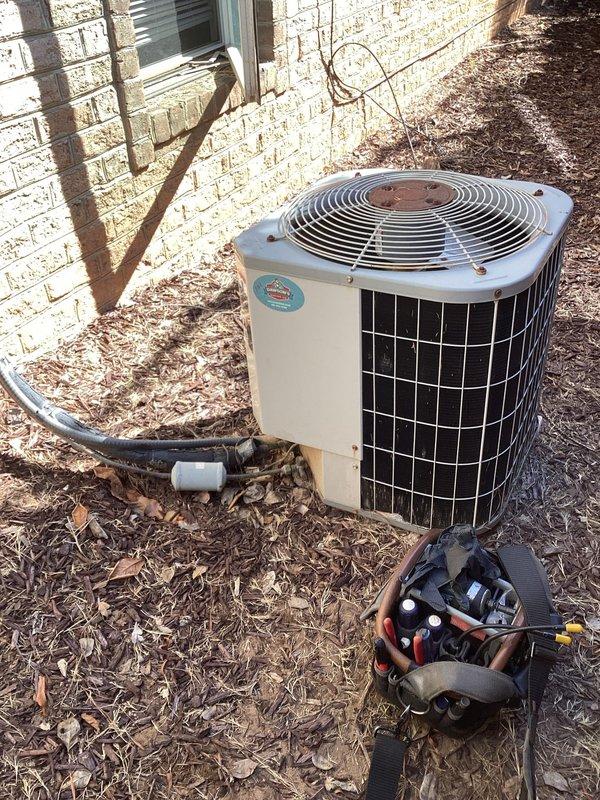 Responded to no cooling call at commercial building with 11+ year old system. Upon arrival, confirmed outdoor condensing unit was not operating. Tested capacitor using Fluke 301D clamp meter and found failed run capacitor preventing compressor from starting. Replaced defective GE 370VAC capacitor with new unit, restored power, and verified system operation with proper compressor startup and cooling cycle.