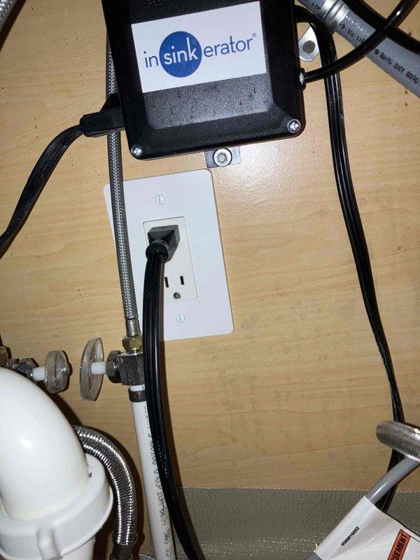 Responded to multiple non-functioning outlets in kitchen and master bedroom areas of a 2021 home. Verified breaker status and tested GFCI outlet under kitchen sink serving garbage disposal circuit using digital voltage tester. Identified tripped GFCI as source of power loss affecting downstream outlets in kitchen and master bath/bedroom areas. Reset GFCI outlet, restored power to all affected receptacles, and verified proper operation of disposal circuit and connected outlets throughout affected zones.