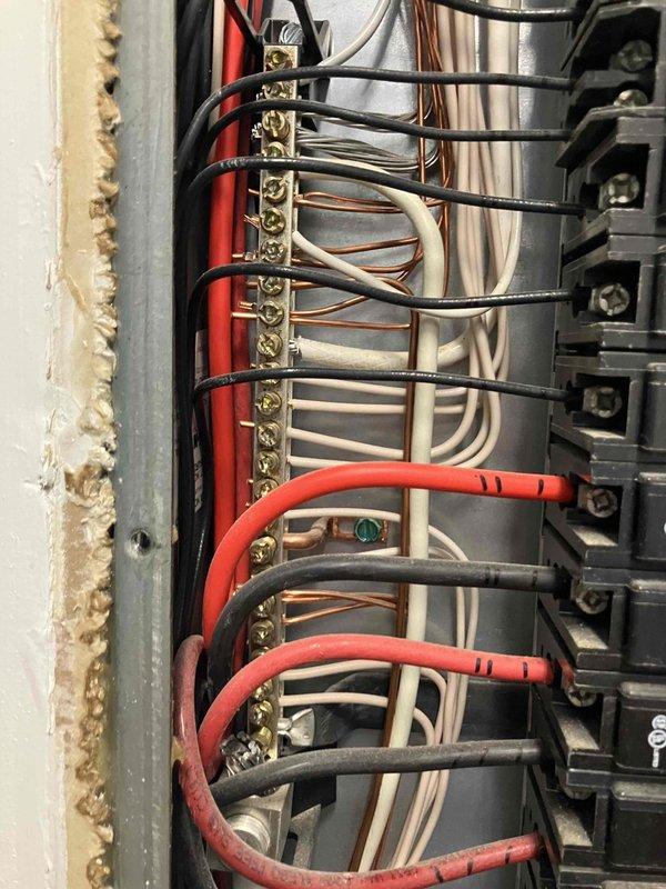 Completed comprehensive 32-point electrical system evaluation on 2016 residential property. Performed electrical panel maintenance including torque verification and connection inspection of all breakers and bus bar terminals. Tested all GFCI shock protection outlets and breakers for proper ground fault functionality, verified arc fault circuit interrupter breakers for fire protection compliance. Conducted smoke and carbon monoxide detector maintenance including battery replacement and operational testing. Replaced customer-supplied light bulbs in fixtures up to 12 feet and cleaned ceiling fans within accessible height range. All systems tested and confirmed operational with no deficiencies noted.