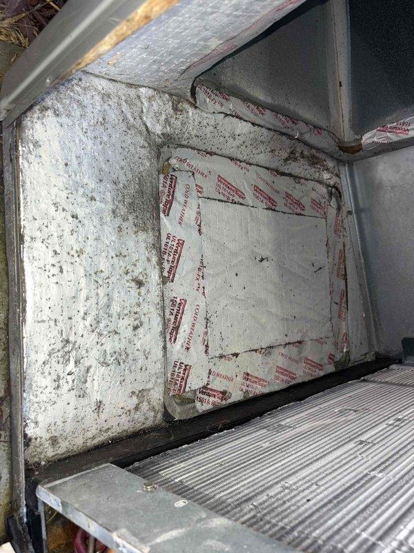 Responded to service call for 3rd floor air handler unit serving 2nd floor with reported standing water in drain pan. Upon inspection, found drain pan containing water with significant rust corrosion throughout pan and surrounding components. Observed heavy rust staining on fasteners and metal surfaces, along with deteriorated and soiled insulation materials within unit cabinet showing extensive dirt accumulation and degradation. Documented conditions with photographs showing extent of corrosion, water damage, and insulation deterioration for further assessment and repair recommendations.