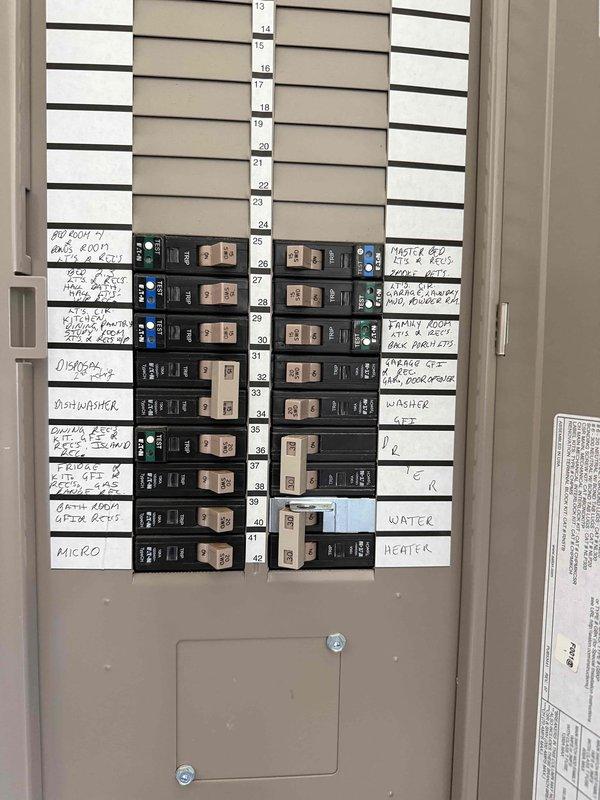 Responded to a recurring circuit breaker trip affecting two bedrooms, one bathroom, and hallway lighting in a six-year-old residential property. Upon arrival, inspected the main electrical panel and identified the problematic single-pole breaker controlling the affected circuits. Conducted visual inspection of the panel, verified all wire connections at the breaker terminals, and tested the breaker for proper operation. Documented panel configuration showing organized circuit layout with labeled breakers for various household zones and appliances. Presented repair options to the homeowner for addressing the tripping issue and restoring reliable power to the affected areas.