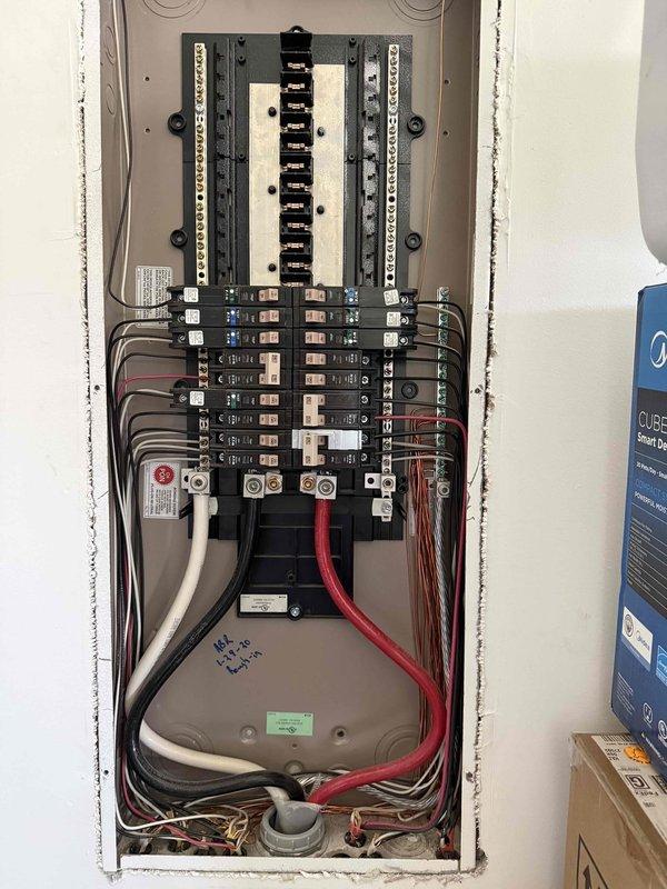 Responded to a recurring circuit breaker trip affecting two bedrooms, one bathroom, and hallway lighting in a six-year-old residential property. Upon arrival, inspected the main electrical panel and identified the problematic single-pole breaker controlling the affected circuits. Conducted visual inspection of the panel, verified all wire connections at the breaker terminals, and tested the breaker for proper operation. Documented panel configuration showing organized circuit layout with labeled breakers for various household zones and appliances. Presented repair options to the homeowner for addressing the tripping issue and restoring reliable power to the affected areas.
