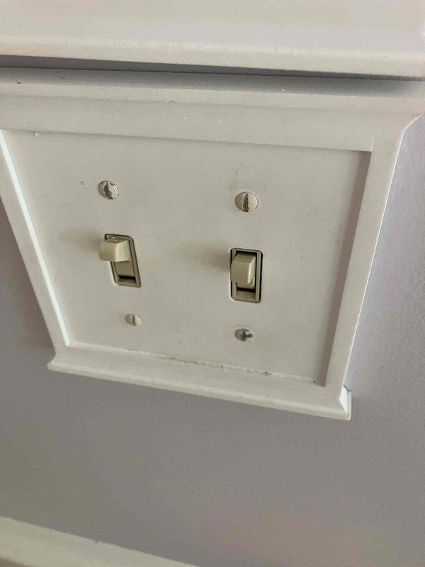 Responded to a non-functioning kitchen light switch that was previously making crackling sounds. Inspected the two-way switch configuration, verified the breaker was operational, and assessed the double-gang switch plate for electrical faults. Addressed the failed switch mechanism to restore proper lighting control in the kitchen.