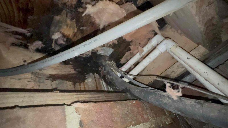 Responded to service call for reported water leak in crawlspace that was initially suspected to be HVAC-related. Accessed crawlspace and inspected both HVAC systems, condensate drain lines, and evaporator coil drain pans for signs of leakage or overflow. Examined PVC condensate drainage piping and verified proper pitch and flow. Inspected air handler units and surrounding areas for moisture, staining, or active dripping. Found no evidence of HVAC equipment malfunction or condensate system failure causing the reported leak. Systems operating properly with adequate cooling performance and normal condensate drainage function.