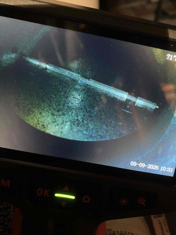Responded to inspection-related service call regarding reversed zoning system. Upon arrival, performed visual inspection of HVAC system and ductwork configuration in basement mechanical room. Utilized borescope inspection camera to examine interior duct conditions, revealing significant microbial growth contamination throughout ductwork requiring immediate attention. Documented Lennox heating unit installation with extensive black flexible ductwork routing, noting potential zoning damper configuration issues that may be causing reversed zone operation. Captured photographic evidence of contaminated duct interiors and overall system layout for further evaluation and recommended remediation planning.