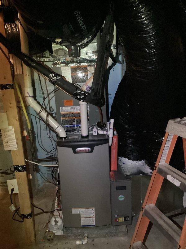 Responded to inspection-related service call regarding reversed zoning system. Upon arrival, performed visual inspection of HVAC system and ductwork configuration in basement mechanical room. Utilized borescope inspection camera to examine interior duct conditions, revealing significant microbial growth contamination throughout ductwork requiring immediate attention. Documented Lennox heating unit installation with extensive black flexible ductwork routing, noting potential zoning damper configuration issues that may be causing reversed zone operation. Captured photographic evidence of contaminated duct interiors and overall system layout for further evaluation and recommended remediation planning.
