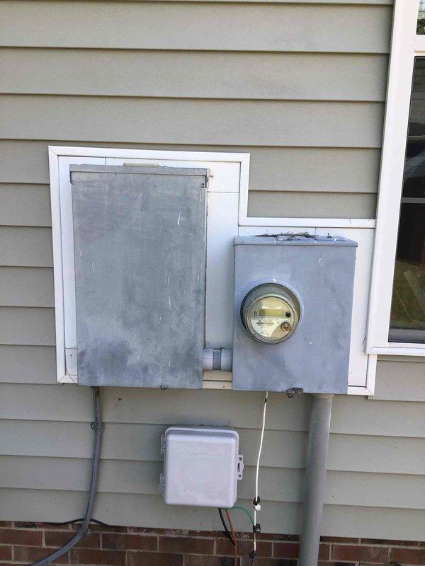 Completed comprehensive 32-point electrical system evaluation on 1990 residential property. Performed electrical panel maintenance including proper torquing of all connections and visual inspection of breaker box components, noting some rust staining on mounting plate and aged wiring configuration. Conducted GFCI/shock protection outlet and breaker testing, arc fault/fire protection breaker testing, and smoke and CO2 detector maintenance with battery replacement to ensure all safety systems functioning properly. Replaced customer-supplied light bulbs in fixtures up to 12 feet and cleaned ceiling fans. Inspected exterior electrical panel, meter box, and associated conduit connections. All safety devices tested and verified operational.