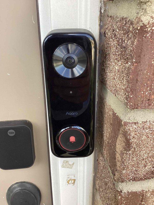 Responded to service call for humming doorbell transformer. Upon arrival, inspected Aqara smart doorbell system and associated low-voltage wiring. Located and examined doorbell transformer, confirmed humming noise originating from transformer unit due to internal component vibration. Replaced defective doorbell transformer with new unit rated for smart doorbell application. Restored power at circuit breaker panel, tested doorbell system for proper operation and verified elimination of humming noise. System functioning normally upon completion.