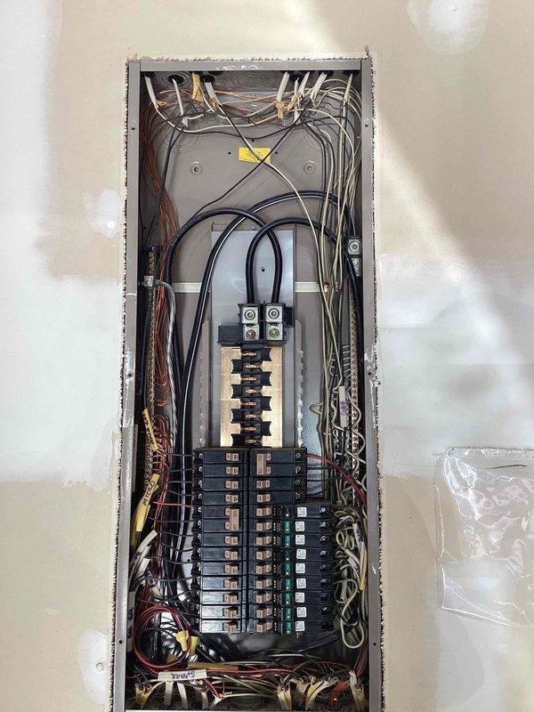 Responded to non-functioning outlet issue in room above garage where two receptacles had lost power. Verified breaker panel operation and confirmed proper circuit breaker positioning, inspected electrical panel for any tripped breakers or loose connections, and troubleshot the affected circuit to identify the source of power loss. All breakers were found in the correct position and panel connections appeared secure upon visual inspection.