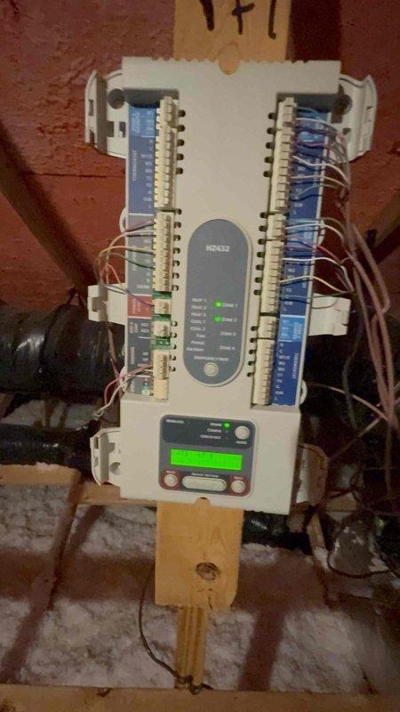 Responded to tenant concern regarding smoke odor potentially entering unit through shared ductwork with neighboring property. Performed thorough inspection of HVAC system including zone control panel in attic space and air handler blower assembly. Inspected all ductwork connections, dampers, and zoning controls for proper sealing and operation. Examined blower wheel and housing for debris accumulation and verified system integrity. Found no evidence of shared ductwork between units or cross-contamination pathways. All duct connections properly sealed with no breaches detected. Zoning system functioning as designed with proper damper operation. Advised that smoke odor is not originating from HVAC system or shared ductwork, as each unit maintains independent air distribution. Recommended tenant contact property management regarding potential external sources of smoke odor.