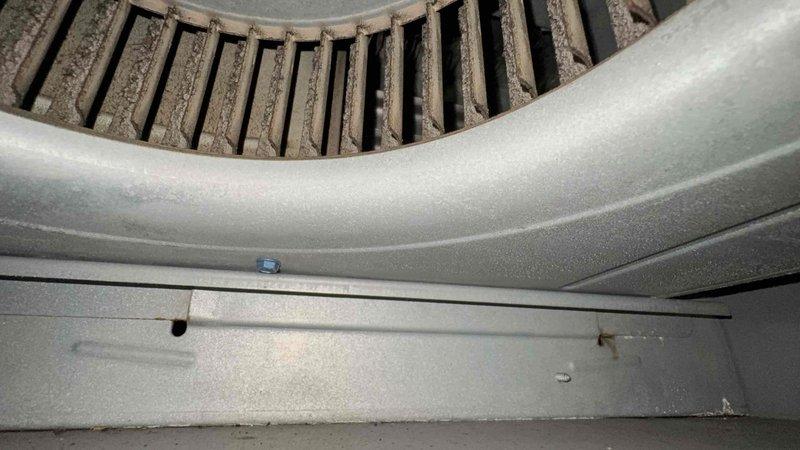 Responded to tenant concern regarding smoke odor potentially entering unit through shared ductwork with neighboring property. Performed thorough inspection of HVAC system including zone control panel in attic space and air handler blower assembly. Inspected all ductwork connections, dampers, and zoning controls for proper sealing and operation. Examined blower wheel and housing for debris accumulation and verified system integrity. Found no evidence of shared ductwork between units or cross-contamination pathways. All duct connections properly sealed with no breaches detected. Zoning system functioning as designed with proper damper operation. Advised that smoke odor is not originating from HVAC system or shared ductwork, as each unit maintains independent air distribution. Recommended tenant contact property management regarding potential external sources of smoke odor.