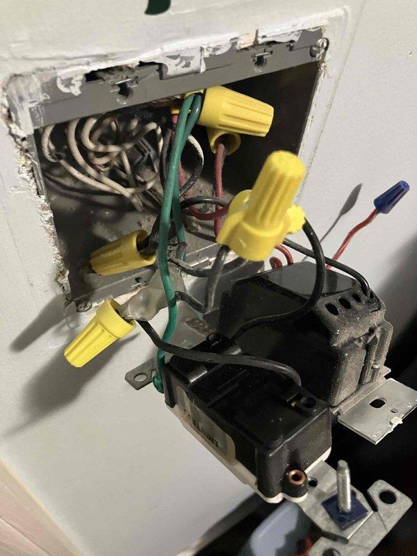 Responded to service call at 1996 residential property for multiple electrical issues. Diagnosed and repaired non-functioning bedroom light switch by accessing wall box, identifying faulty switch mechanism, and documenting existing wiring configuration with multiple conductors and wire connections. Advised customer that bathroom light fixture repair falls outside scope of electrical service, as fixture replacement is homeowner responsibility. Scheduled return appointment for EV charger installation upon equipment arrival.