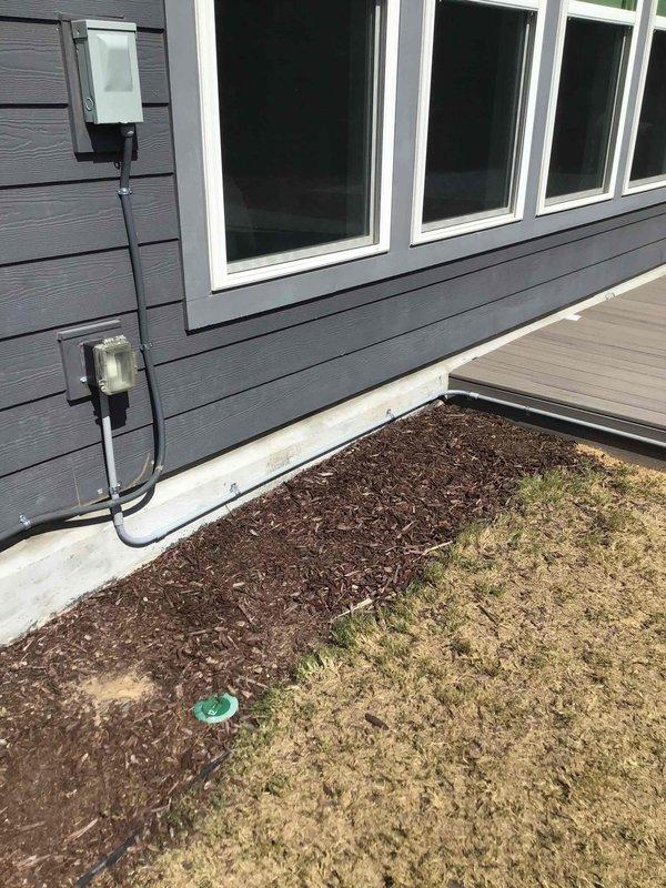 Installed new weatherproof GFCI outlet near deck area with gray conduit run along exterior siding, properly mounted and secured to building exterior. Inspected existing outdoor outlet that was experiencing frequent tripping issues; tested GFCI functionality and determined proper operation. All exterior electrical installations completed per code requirements with appropriate weatherproof enclosures and protection.